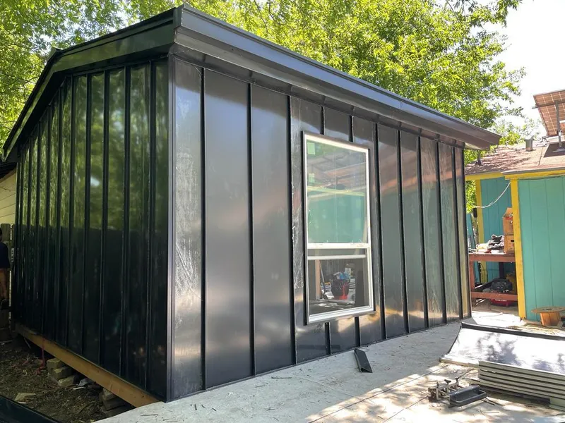 Black standing seam metal wall panels for Roof Inspection in Sequim